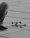 feet beside skateboard